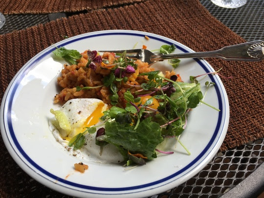 Micro greens with nasturtiums and cherry tomatoes, tomato risotto made from farmers' market tomatoes roasted with fresh herbs and garlic, and poached farmers' market brown eggs... And it was delicious!