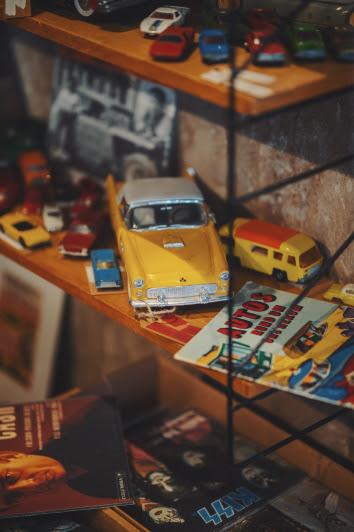 Yellow collectible car toy on shelf