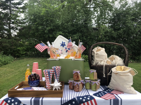 Picnic table with American flags and Independence Day decorations