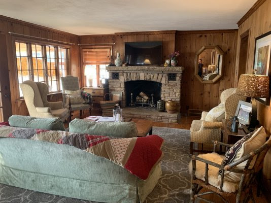 Inside of cozy cottage with fireplace